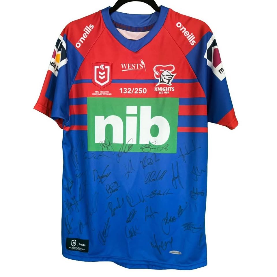 Front of the Newcastle Knights jersey with the numbered 132/250 mark and signatures across the front